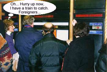 [MC and Zaffy trying to get tickets for the tube.]