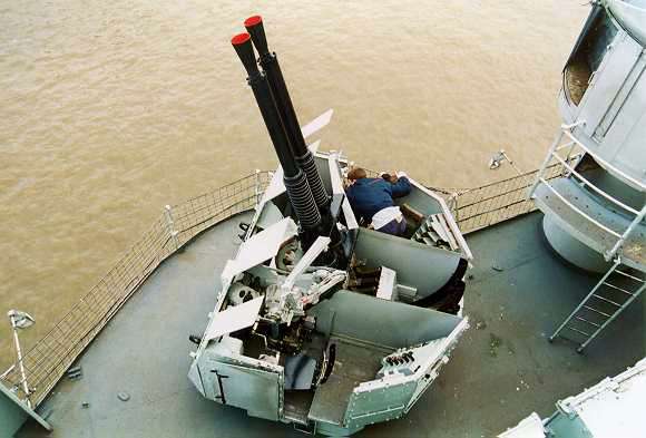 [Children playing with a 40mm Bofors Anti Aircraft gun]